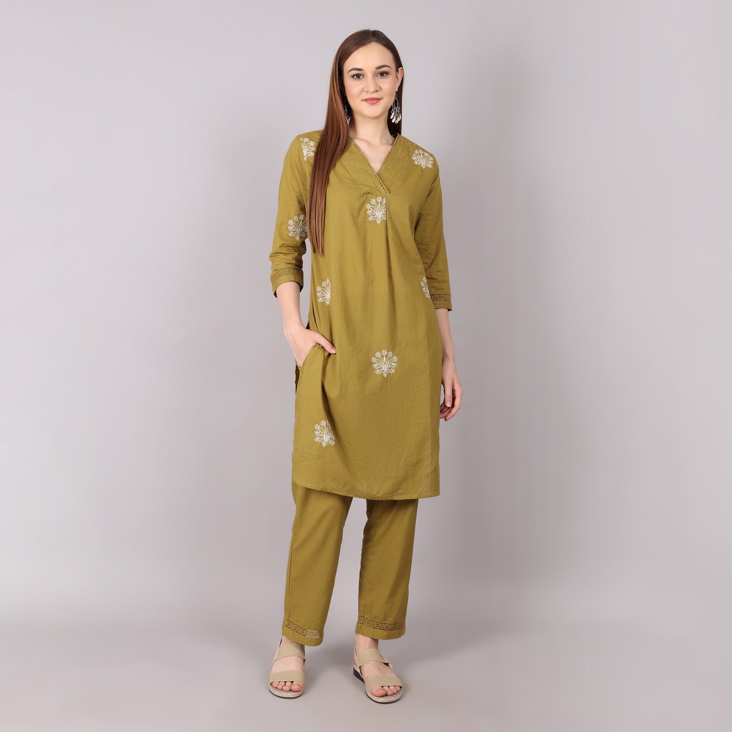 Trendy pure cotton kurta set featuring intricate floral embroidery, pleated design, and dazzling bead and stone embellishments.