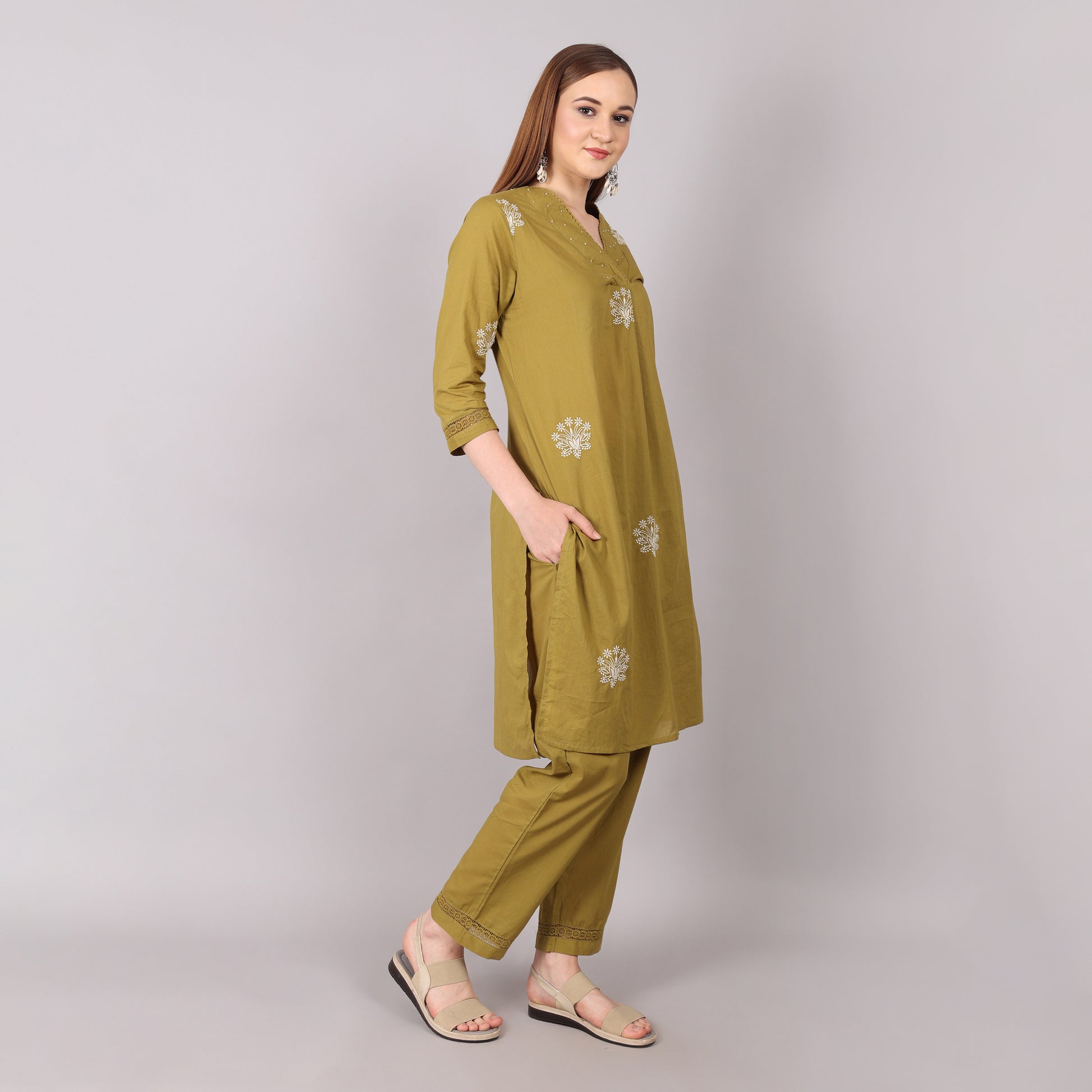 Chic and comfortable pleated pure cotton kurta set with exquisite floral embroidery and shimmering bead and stonework.