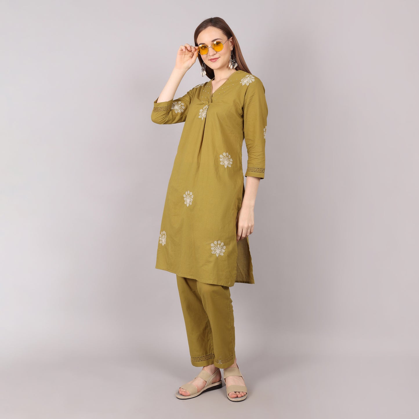 Elegant pure cotton kurta set featuring floral embroidery with pleated details, adorned with beads and stones for a sophisticated look.
