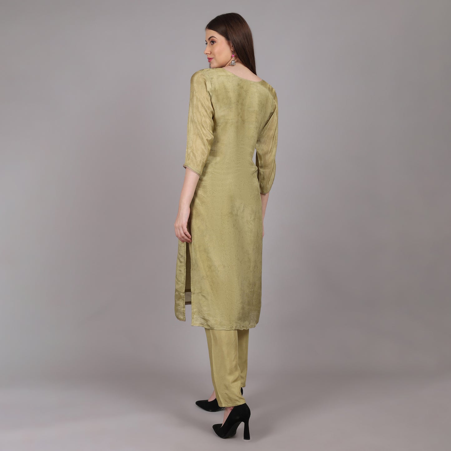 Sophisticated green tissue silk kurta set designed for effortless grace and timeless appeal.