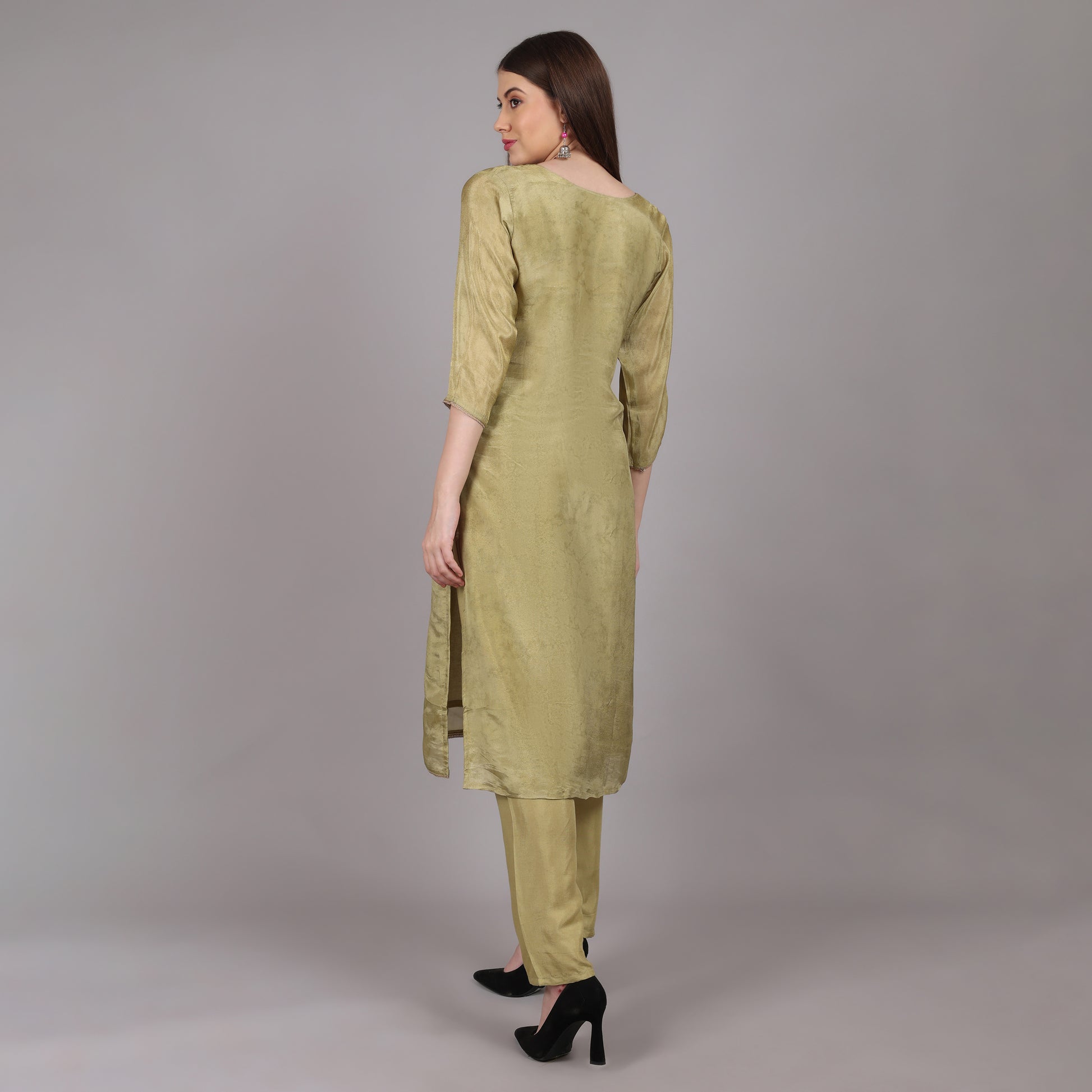 Sophisticated green tissue silk kurta set designed for effortless grace and timeless appeal.