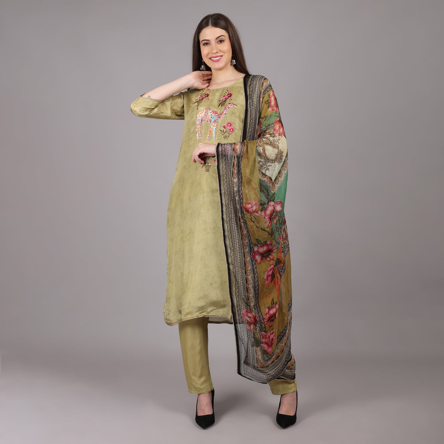 Graceful green soft tissue silk kurta set blending traditional charm with modern sophistication.