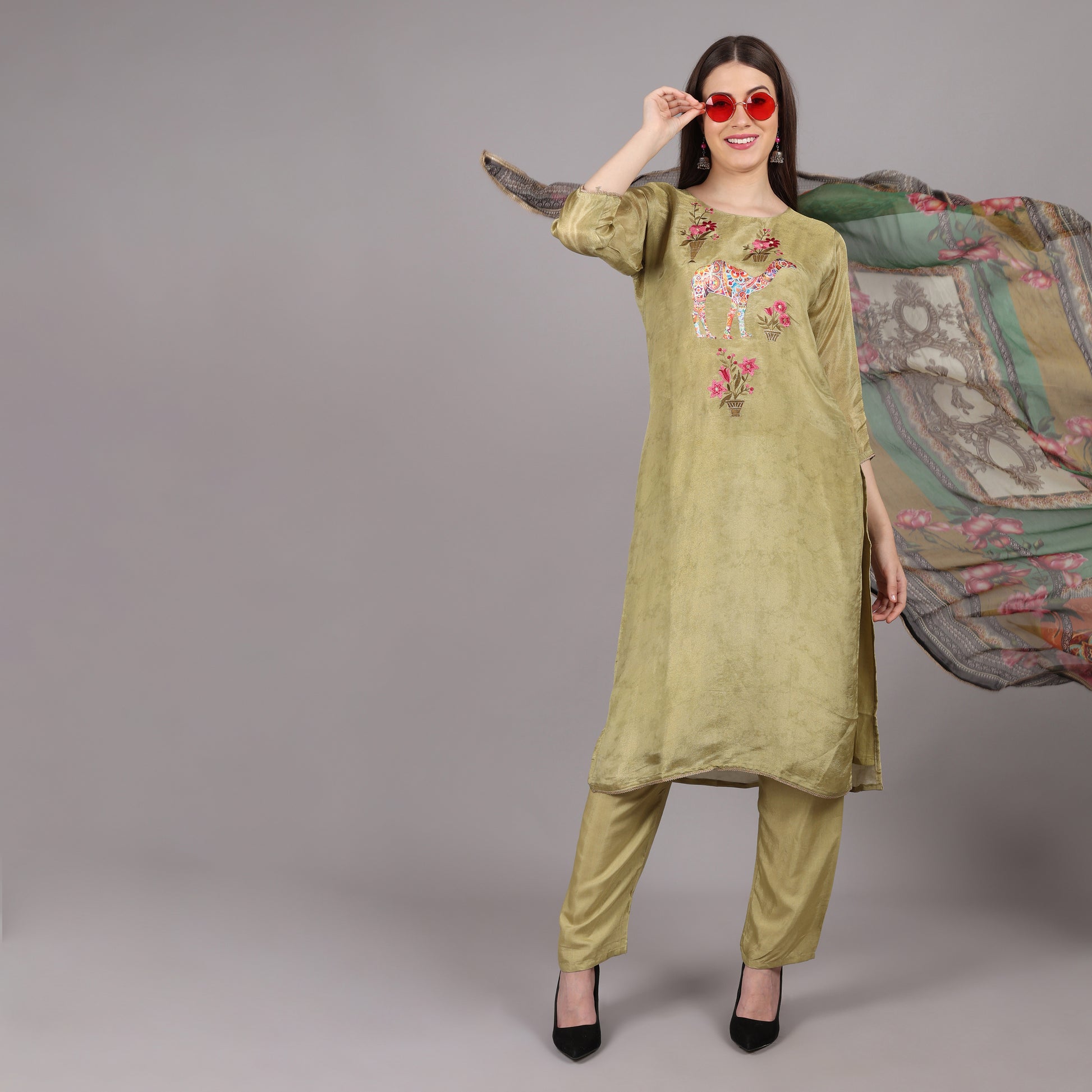 Elegant green soft tissue silk kurta set featuring a luxurious sheen and delicate texture.