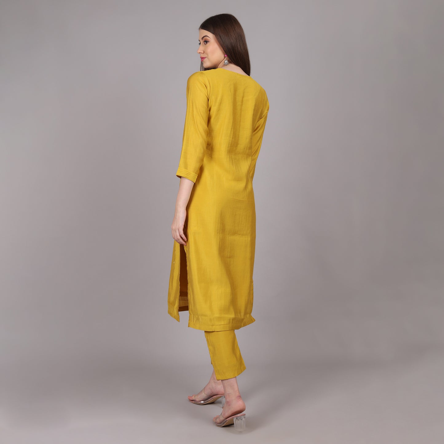 Lightweight and breathable yellow Dola silk kurta set, offering effortless style and sophistication.