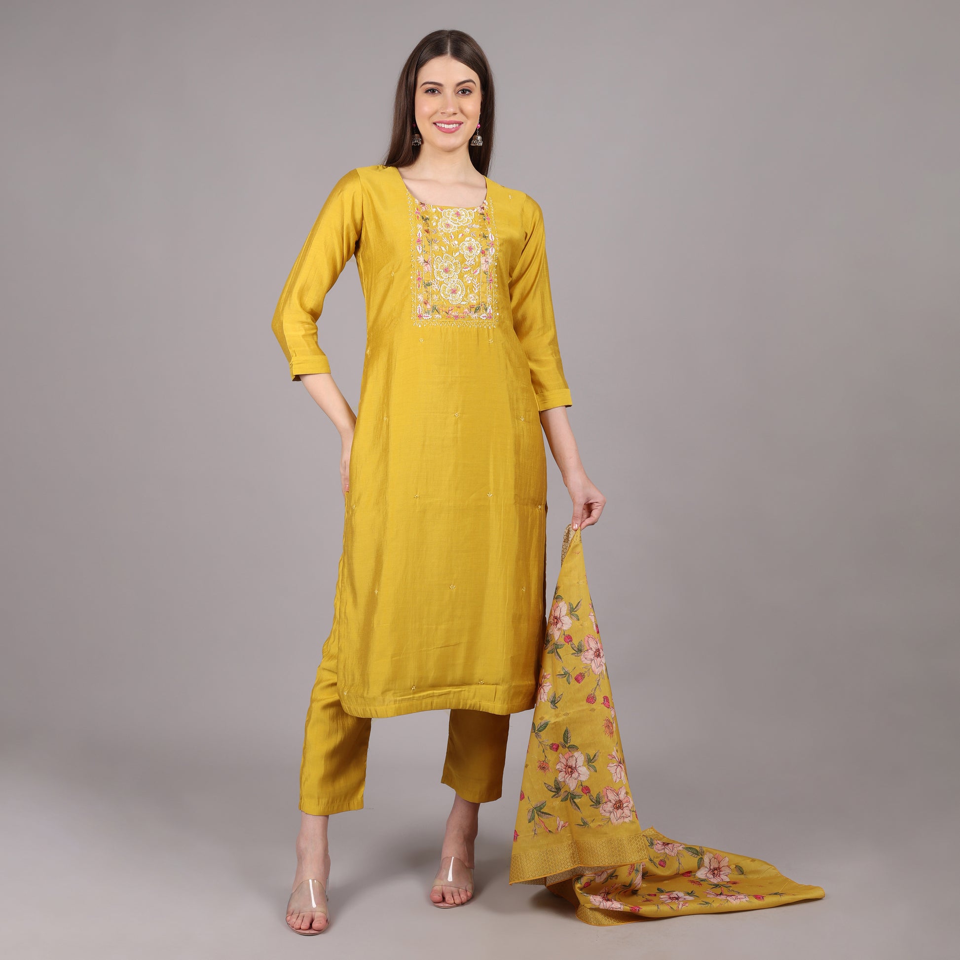 Elegant yellow Dola silk kurta set featuring a luxurious sheen and a graceful silhouette.