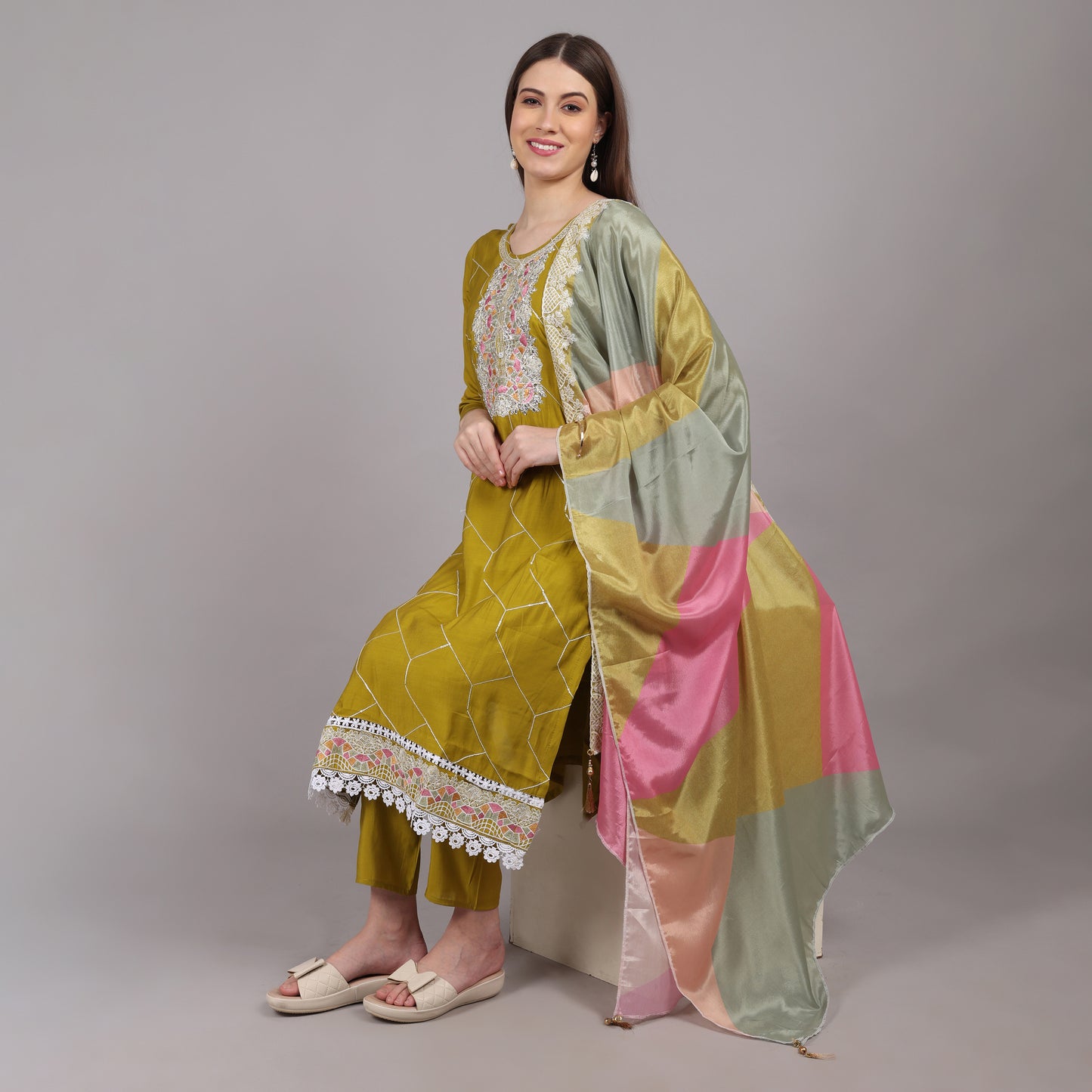 Lightweight and breathable muslin kurta set with intricate hand embroidery, offering comfort and style.