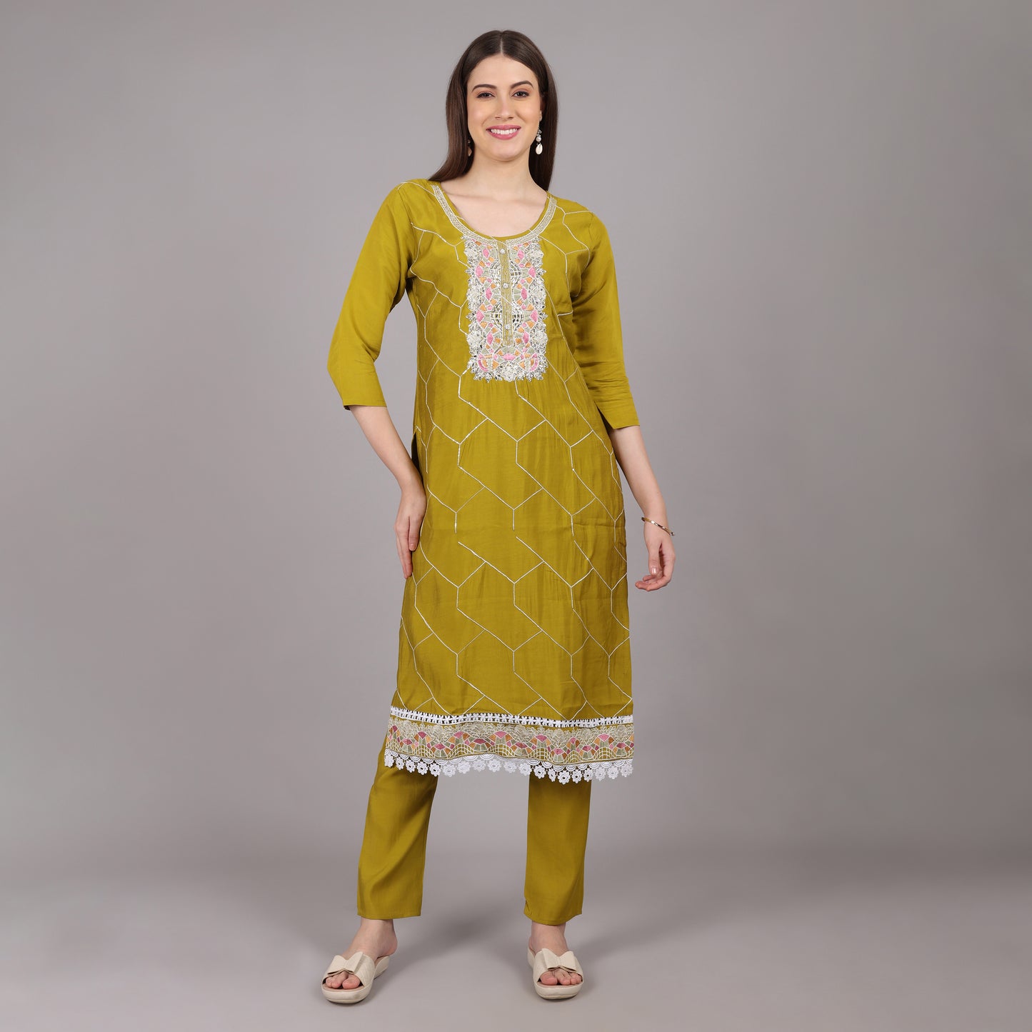Graceful muslin kurta set with fine handwork, blending traditional craftsmanship with modern elegance.
