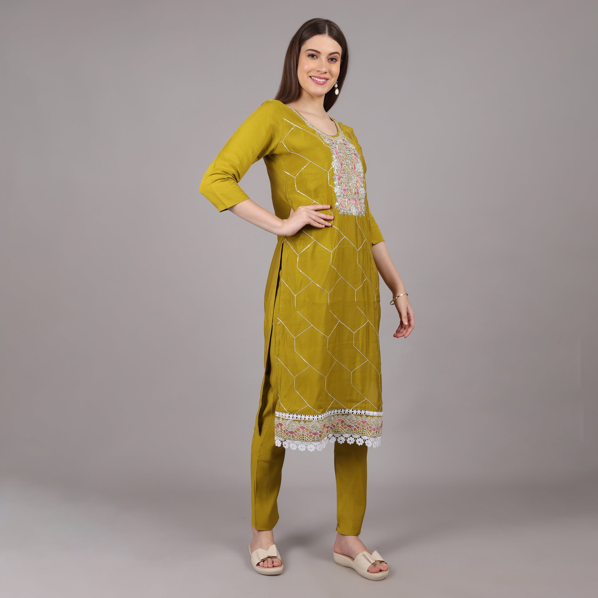Chic and stylish muslin kurta set featuring delicate hand embroidery for a timeless appeal.