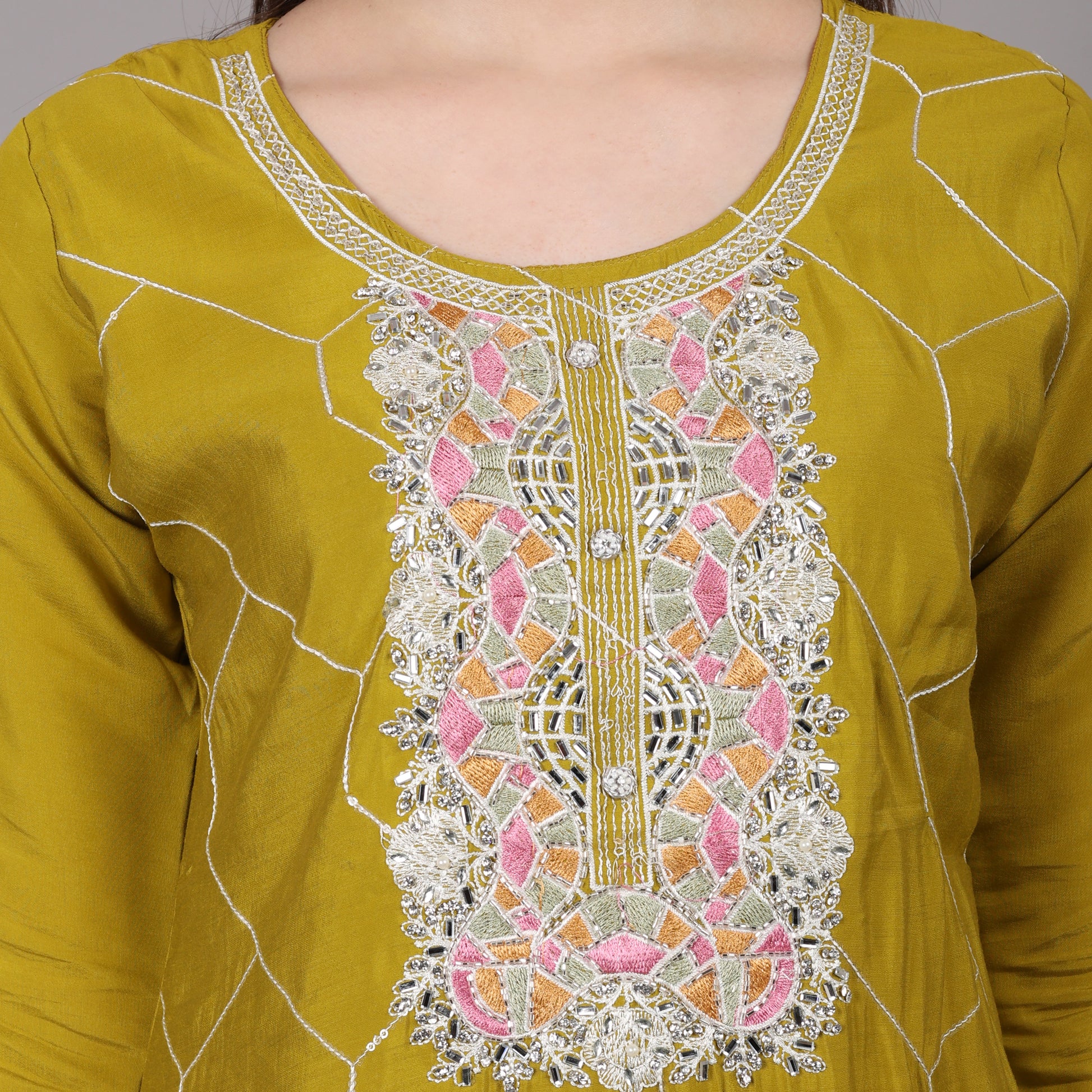 Elegant muslin kurta set with intricate handwork, perfect for a sophisticated ethnic look.