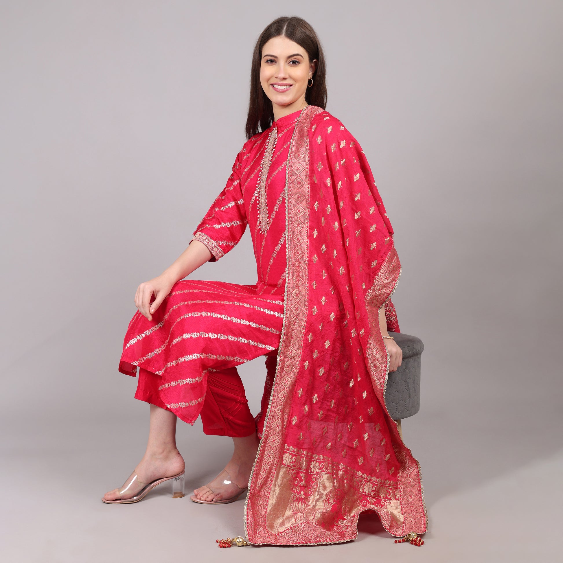 Elegant hot pink Dola silk kurta set featuring a rich sheen and graceful silhouette.