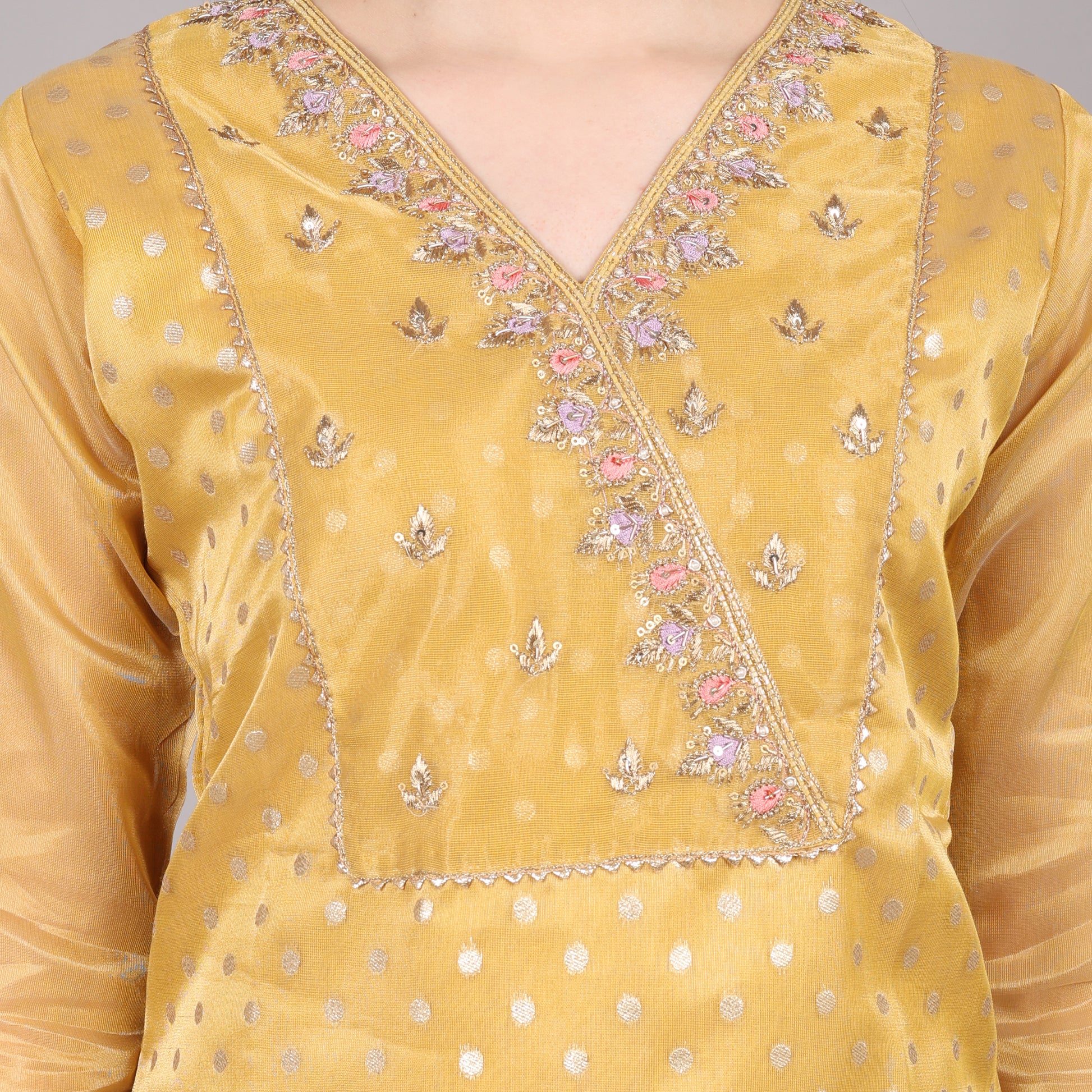 Graceful golden pure tissue kurta set blending traditional craftsmanship with modern sophistication.