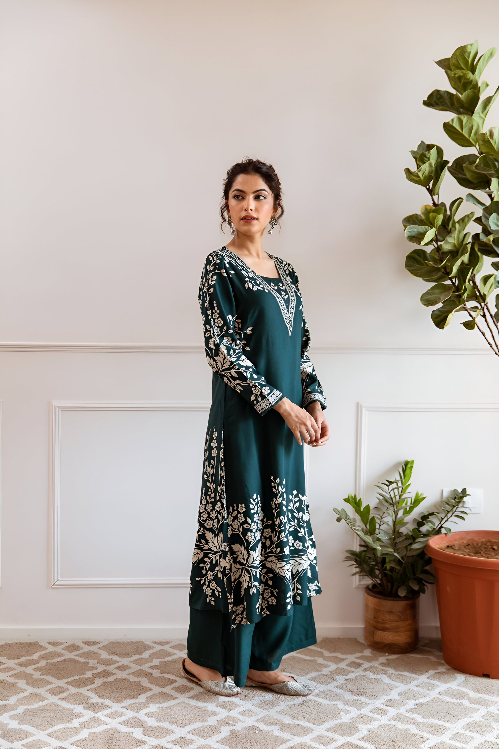 Sophisticated dark teal green kurta set with a timeless A-line cut, offering a refined and graceful appeal.