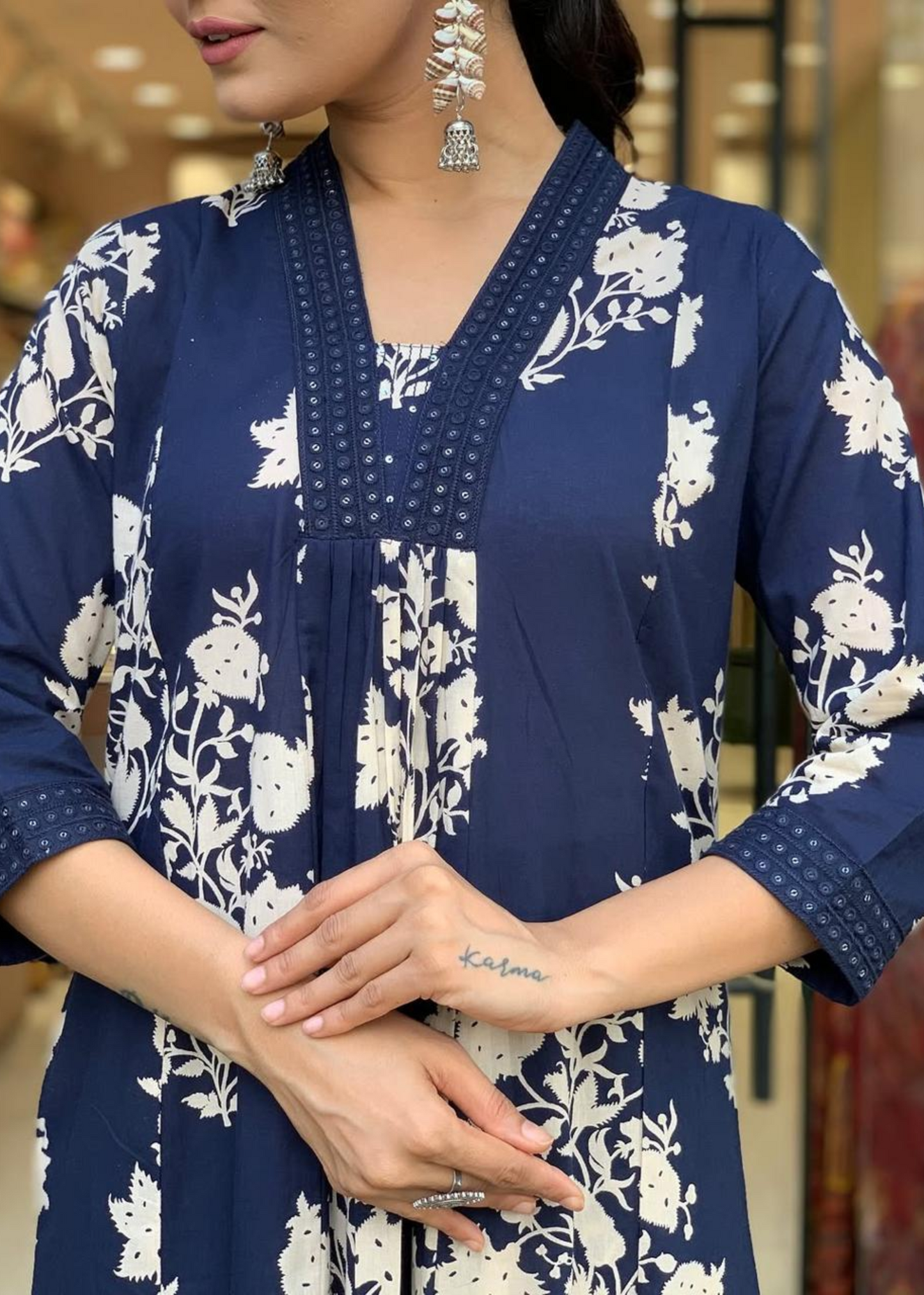 Graceful navy and white floral kurta set with a flowy A-line fit, pleated details, and coordinated palazzos and dupatta.