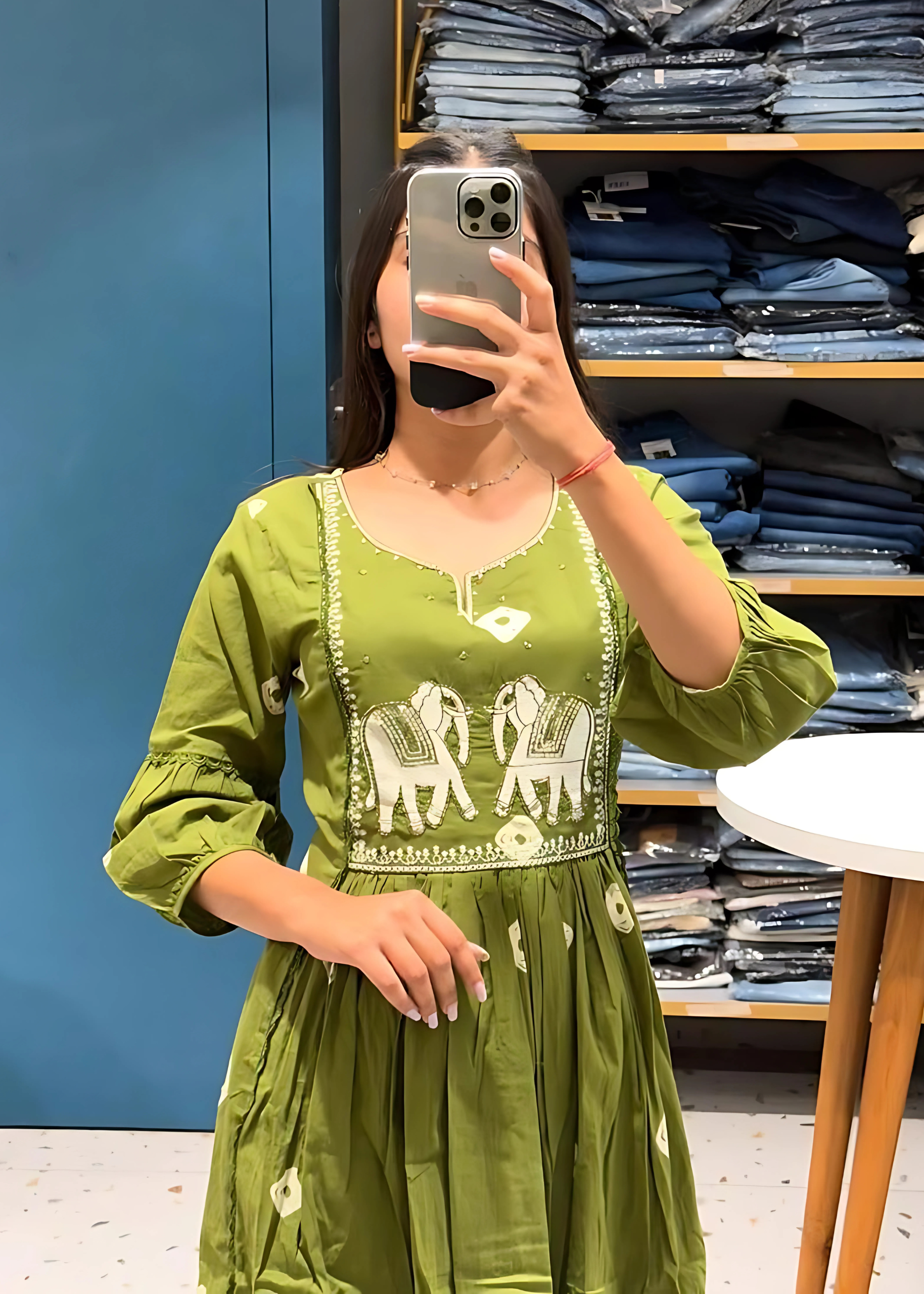 Stylish green embroidered kurta set with elephant motifs, complemented by coordinated pants and a dupatta for a sophisticated touch.