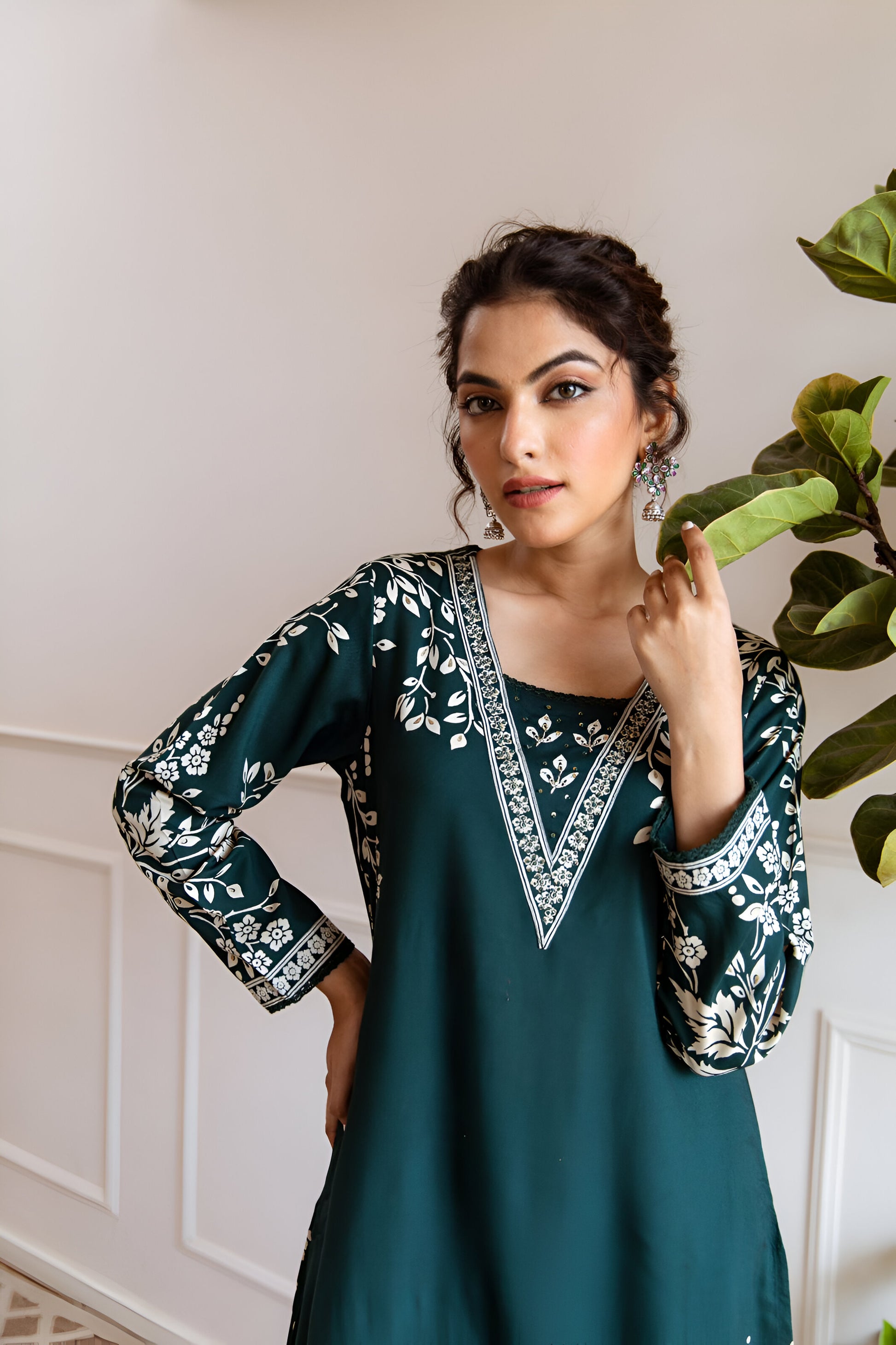 Graceful dark teal green kurta set with a flowy A-line design, blending tradition with modern elegance.