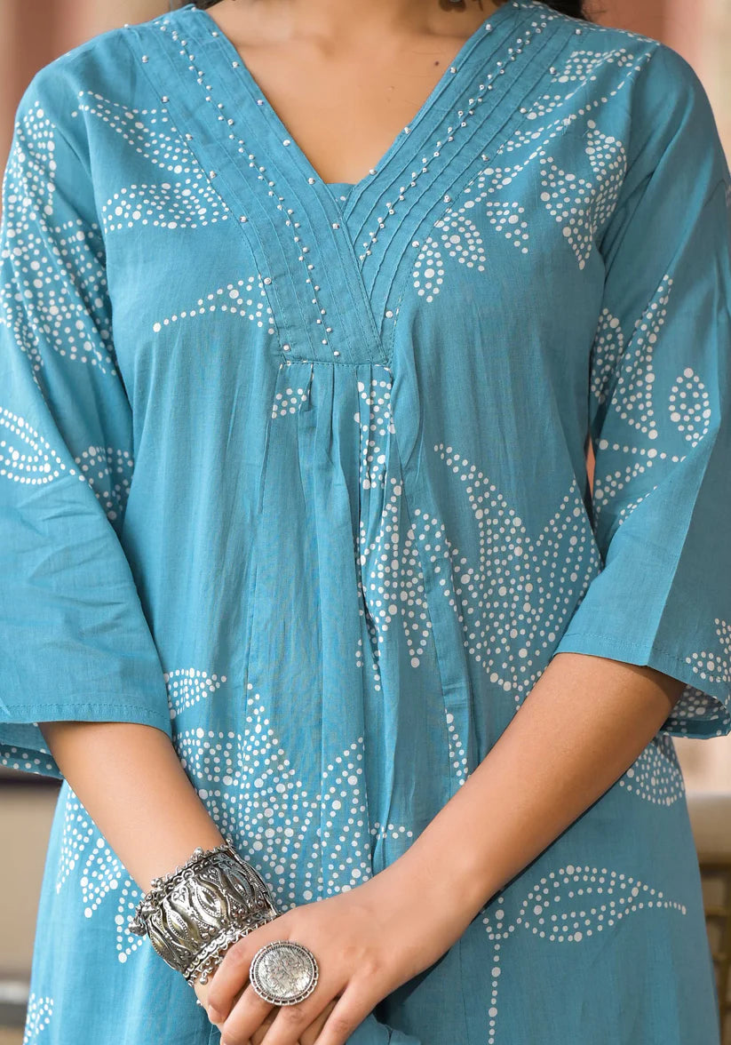 Chic and comfortable Rama blue floral printed A-line kurta set with delicate bead embellishments for a sophisticated touch.