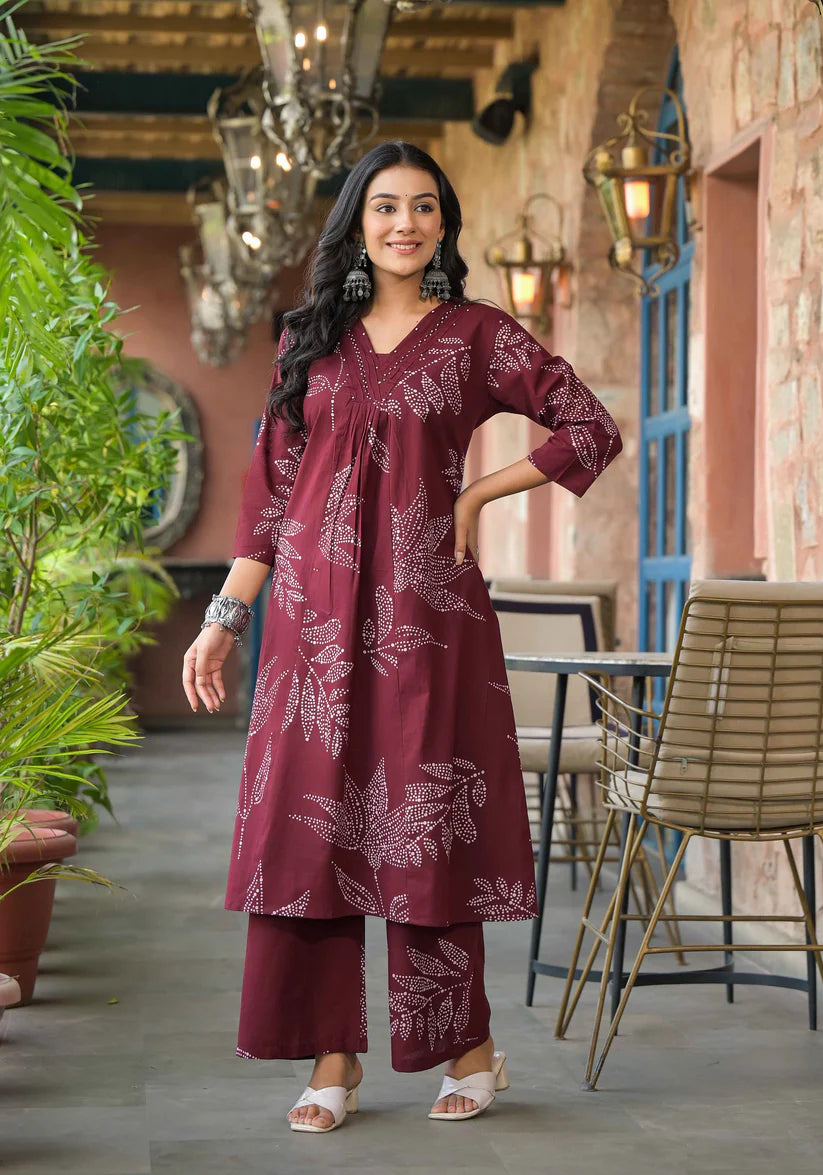 Trendy abstract floral printed Mehroon A-line kurta set featuring exquisite beadwork for a graceful and modern appeal.