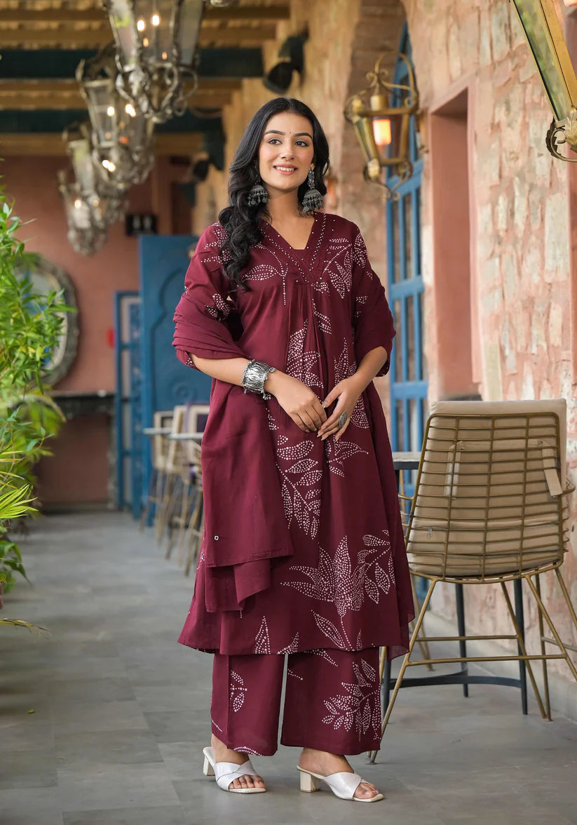 Elegant Mehroon A-line kurta set featuring abstract floral prints and intricate beadwork, perfect for a stylish and sophisticated ethnic look.