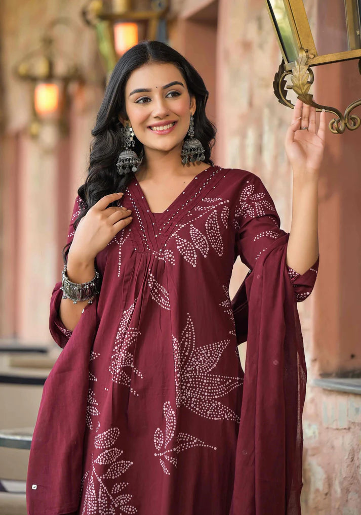 Lightweight and elegant Mehroon kurta set with stunning abstract floral patterns and intricate bead embellishments for a refined finish.