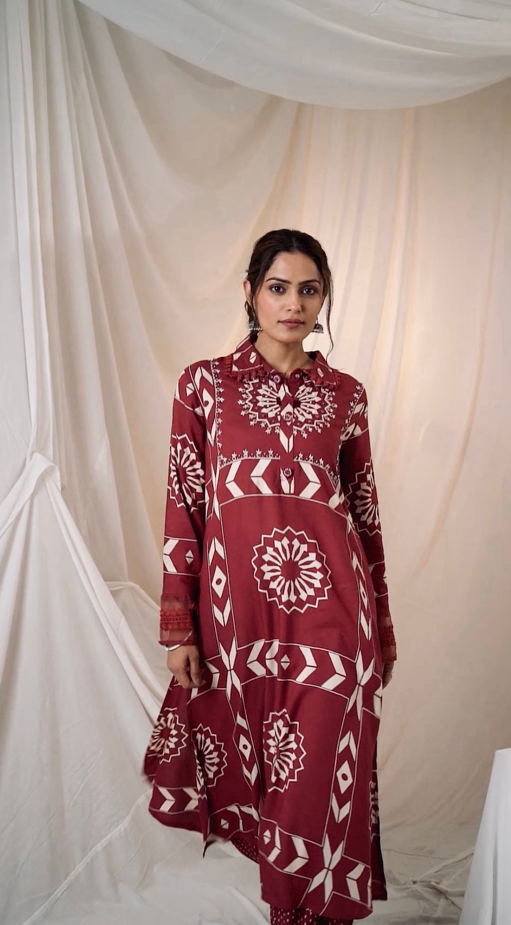 Chic maroon A-line kurta set featuring a flattering silhouette, perfect for festive and casual wear.