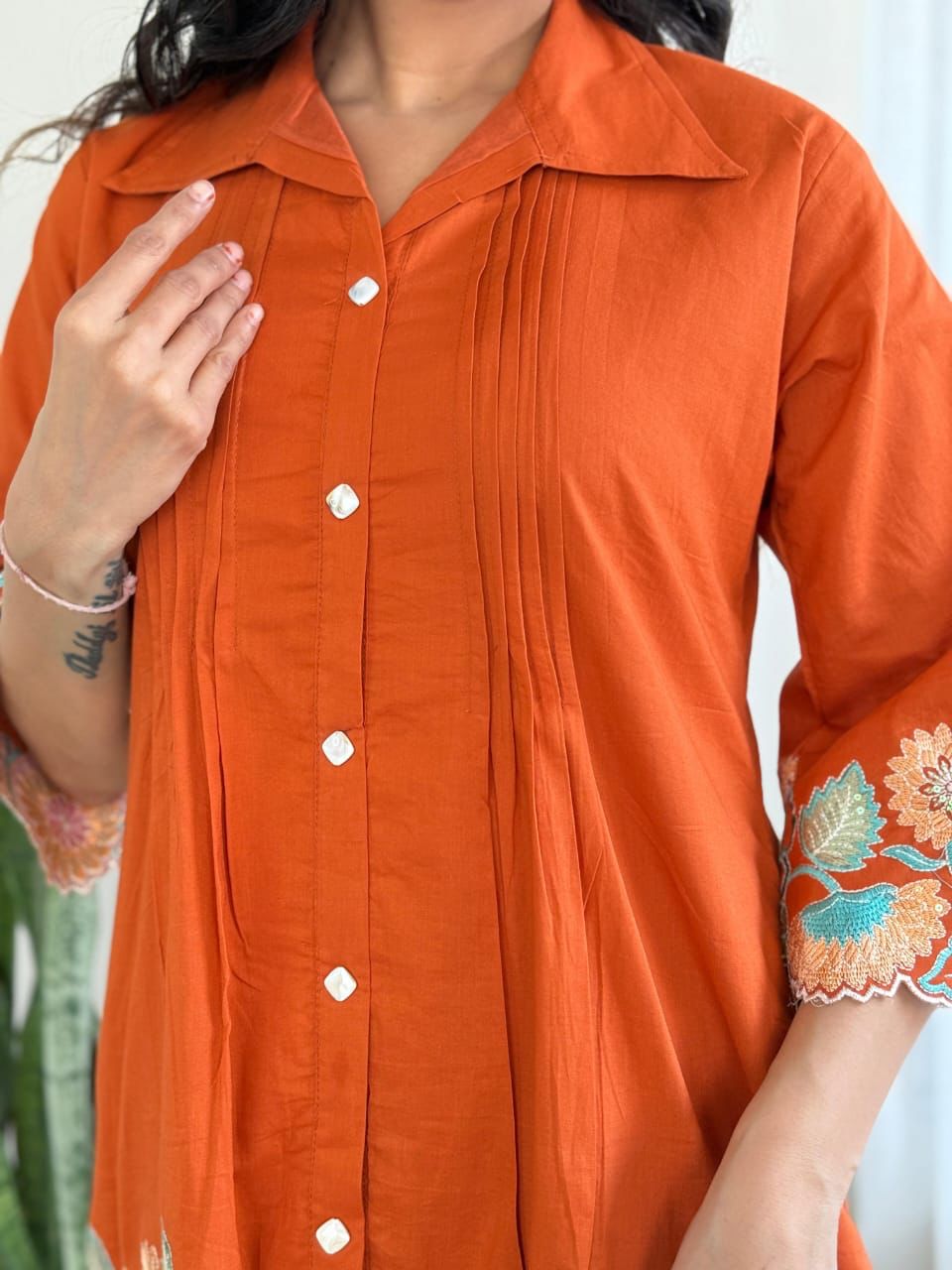Chic and comfortable embroidered orange cotton co-ord set with sequin accents, ideal for casual and party wear.