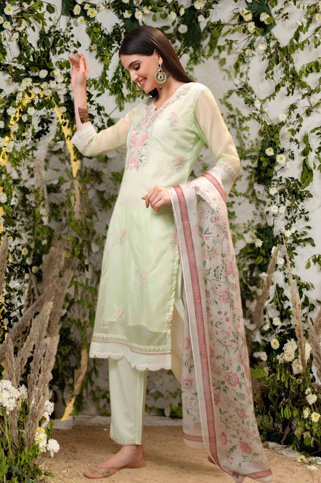 Elegant green organza suit set featuring a lightweight and flowy design for a sophisticated ethnic look.