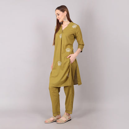 Graceful floral embroidered kurta set in pure cotton, designed with pleats and delicate bead and stone accents for elegance.