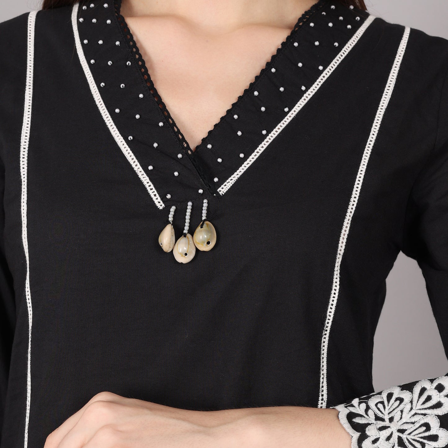 Chic black cotton co-ord set featuring a sophisticated design, perfect for casual and party wear.