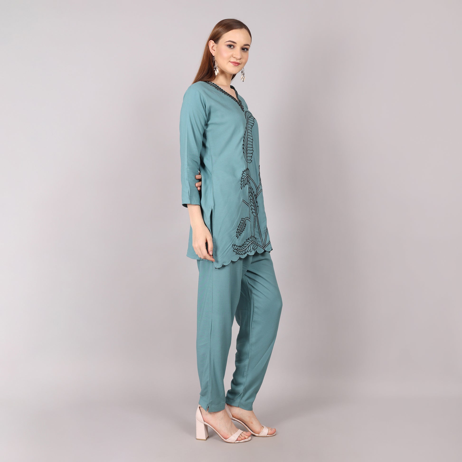 Elegant teal embroidered co-ord set featuring intricate detailing for a sophisticated and stylish look.