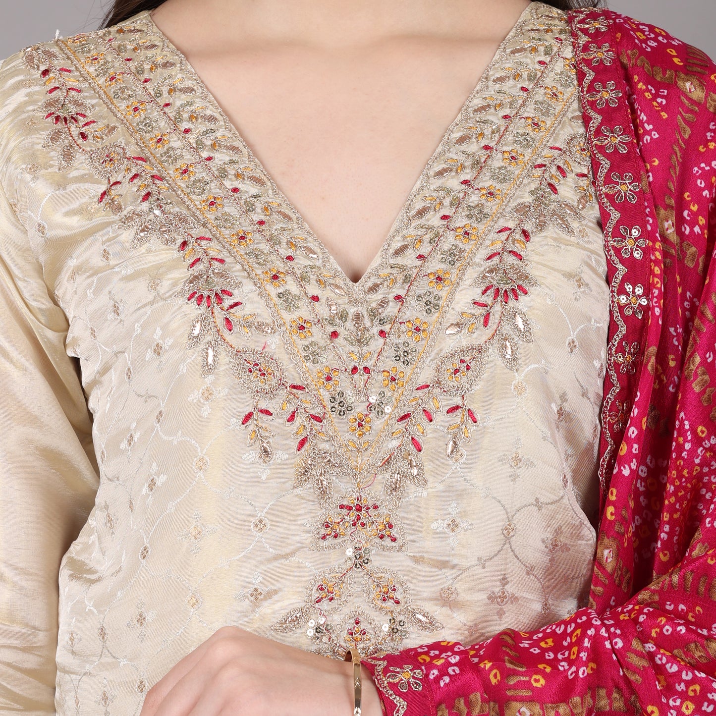 Sophisticated Jacquard tissue kurta set with a rich texture, complemented by a vibrant Gatchola dupatta.