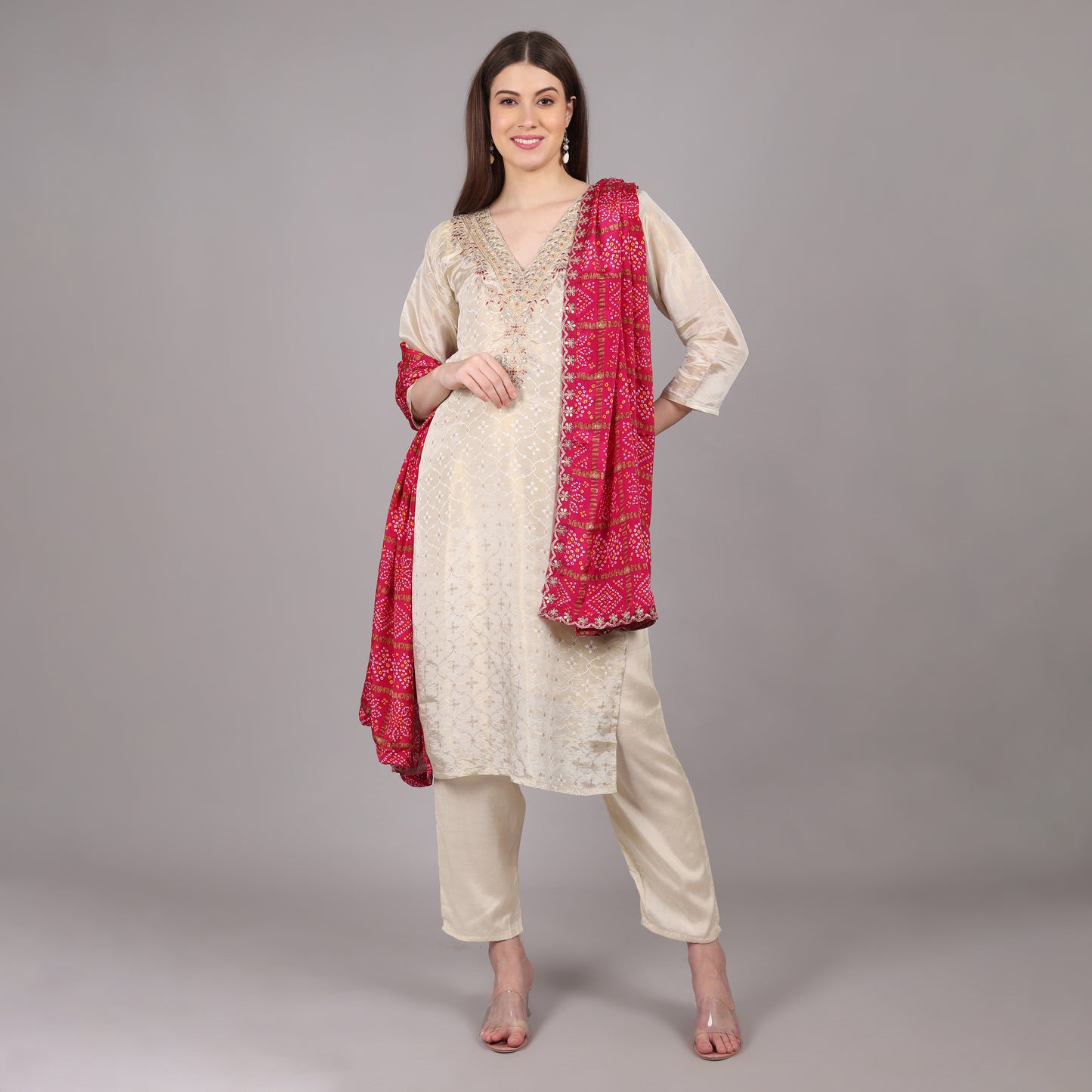 Elegant Jacquard tissue kurta set paired with a traditional Gatchola dupatta for a regal look.
