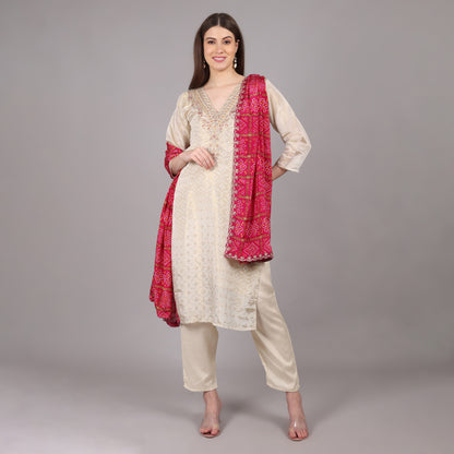 Elegant Jacquard tissue kurta set paired with a traditional Gatchola dupatta for a regal look.
