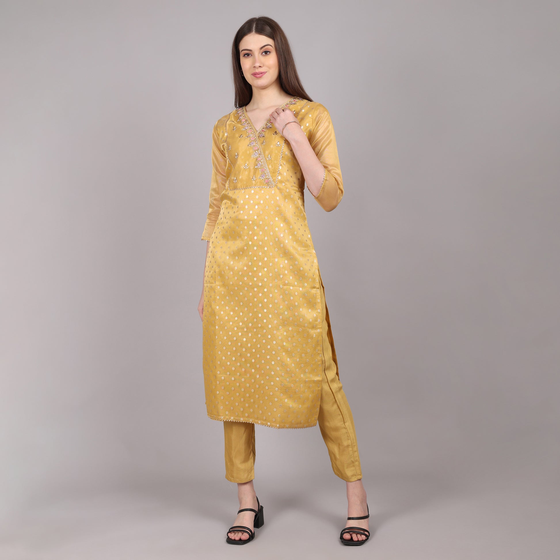 Trendy golden tissue kurta set with a rich texture, ideal for special celebrations.
