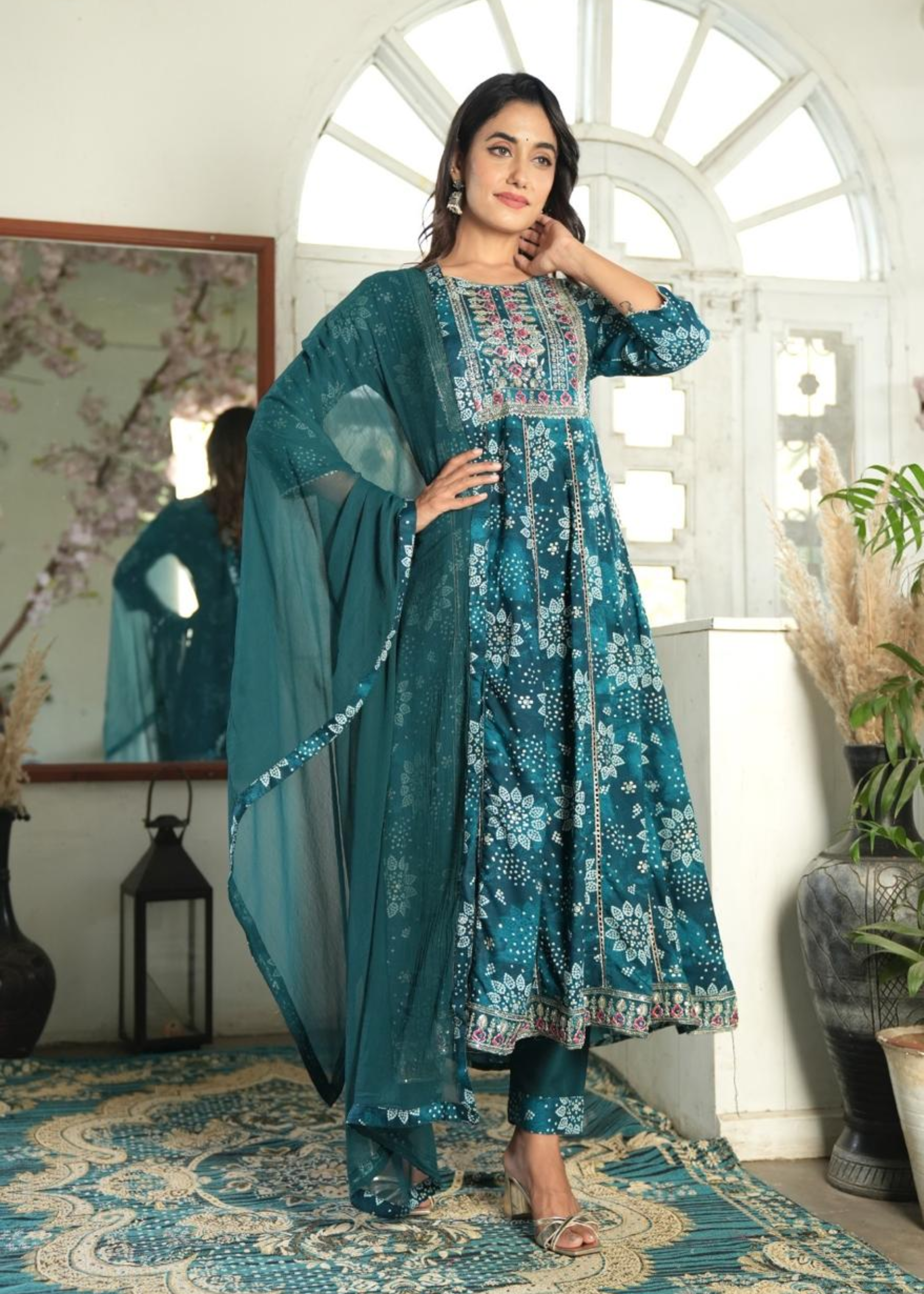Elegant Bandhni print Anarkali kurti paired with matching pants and a dupatta for a traditional look.
