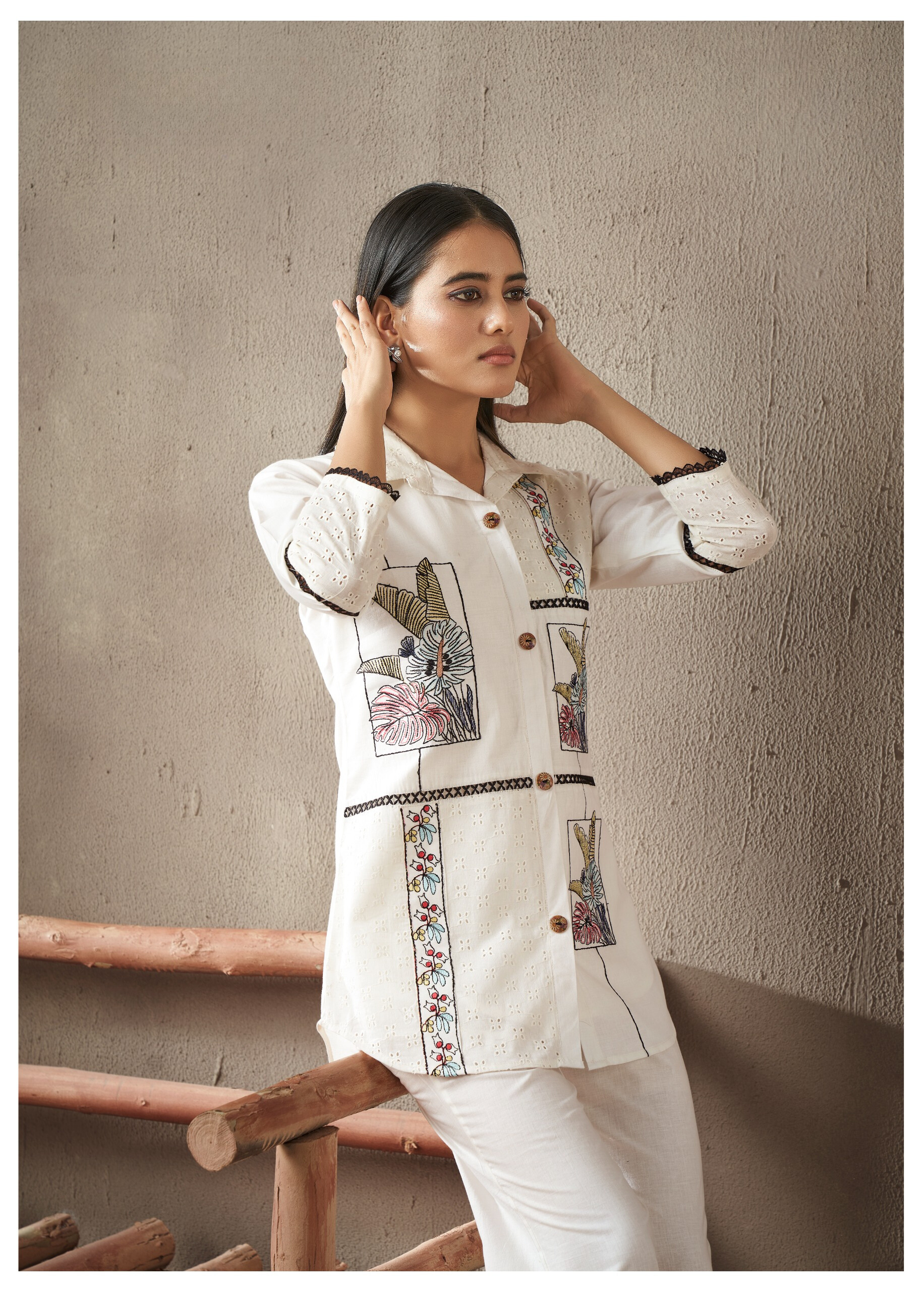 Elegant off-white Schiffli embroidered co-ord set featuring intricate cutwork for a timeless and stylish look.