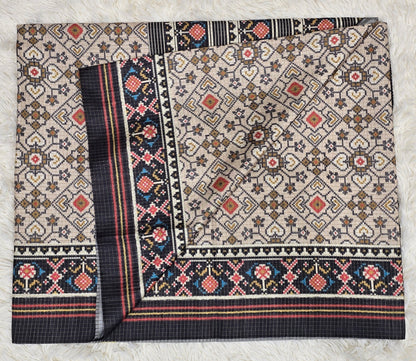 Elegant Cream & Black Tussar Silk Patola Print Saree