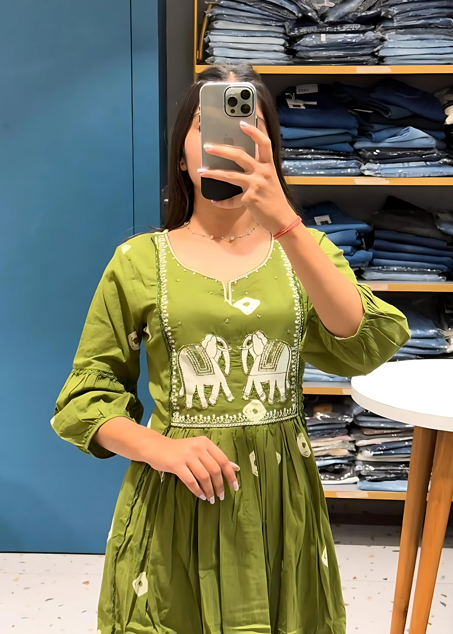 Stylish green embroidered kurta set with elephant motifs, complemented by coordinated pants and a dupatta for a sophisticated touch.