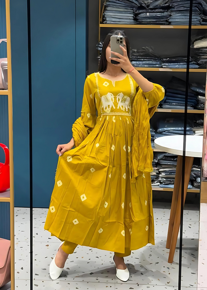 Stylish yellow embroidered kurta set with elephant motifs, complemented by coordinating pants and a dupatta for a traditional touch.