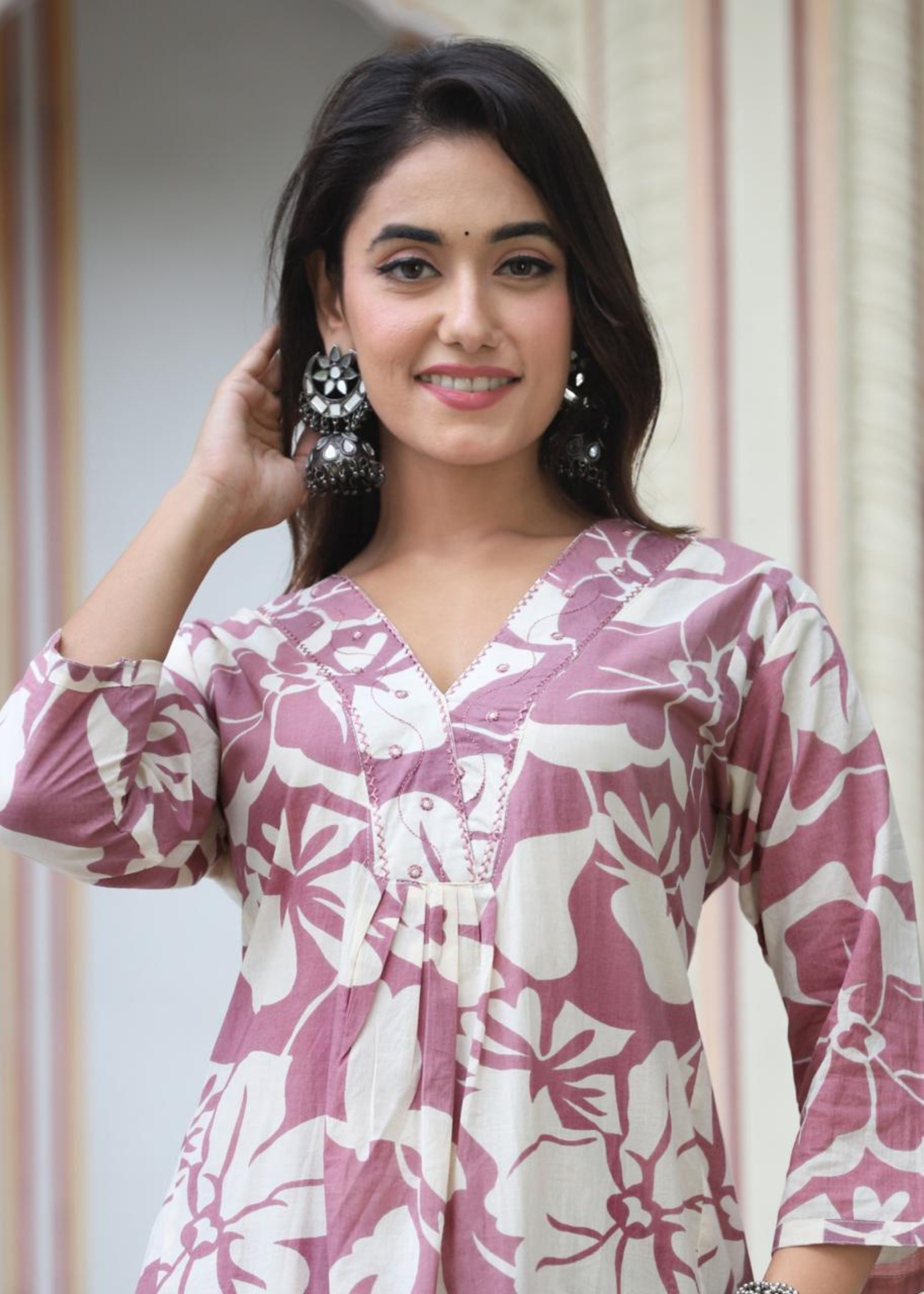 Sophisticated purple kurta with delicate floral prints, complemented by a comfortable and flowy palazzo.






