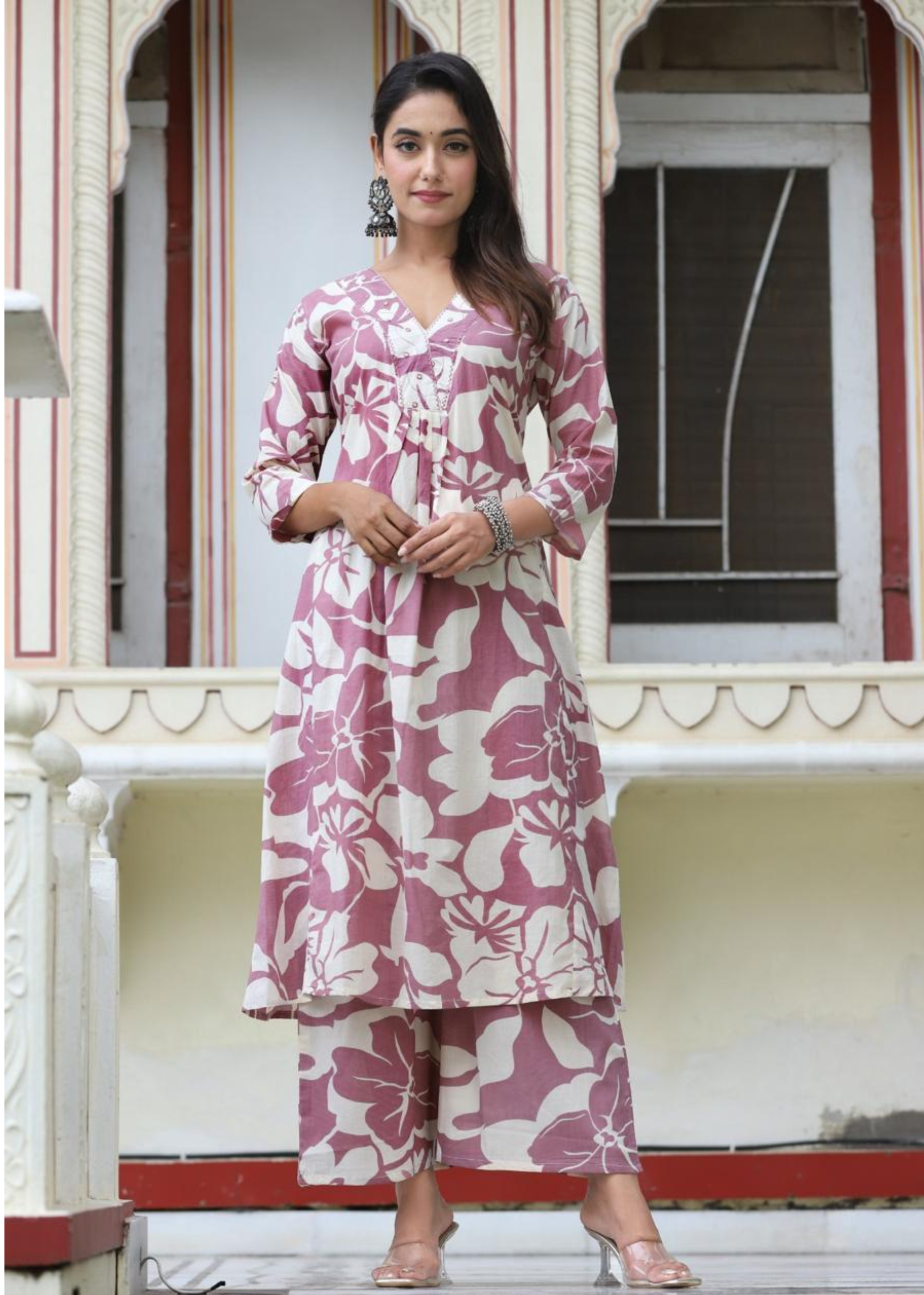 Chic and breezy floral printed kurta set in purple, featuring a classic design with coordinated palazzos.
