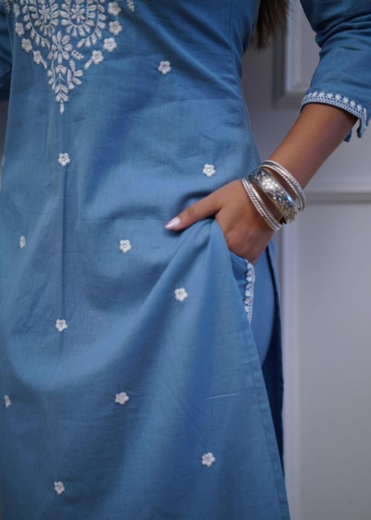 A soft and breathable cotton kurta set featuring delicate embroidery, perfect for a stylish yet comfortable look.