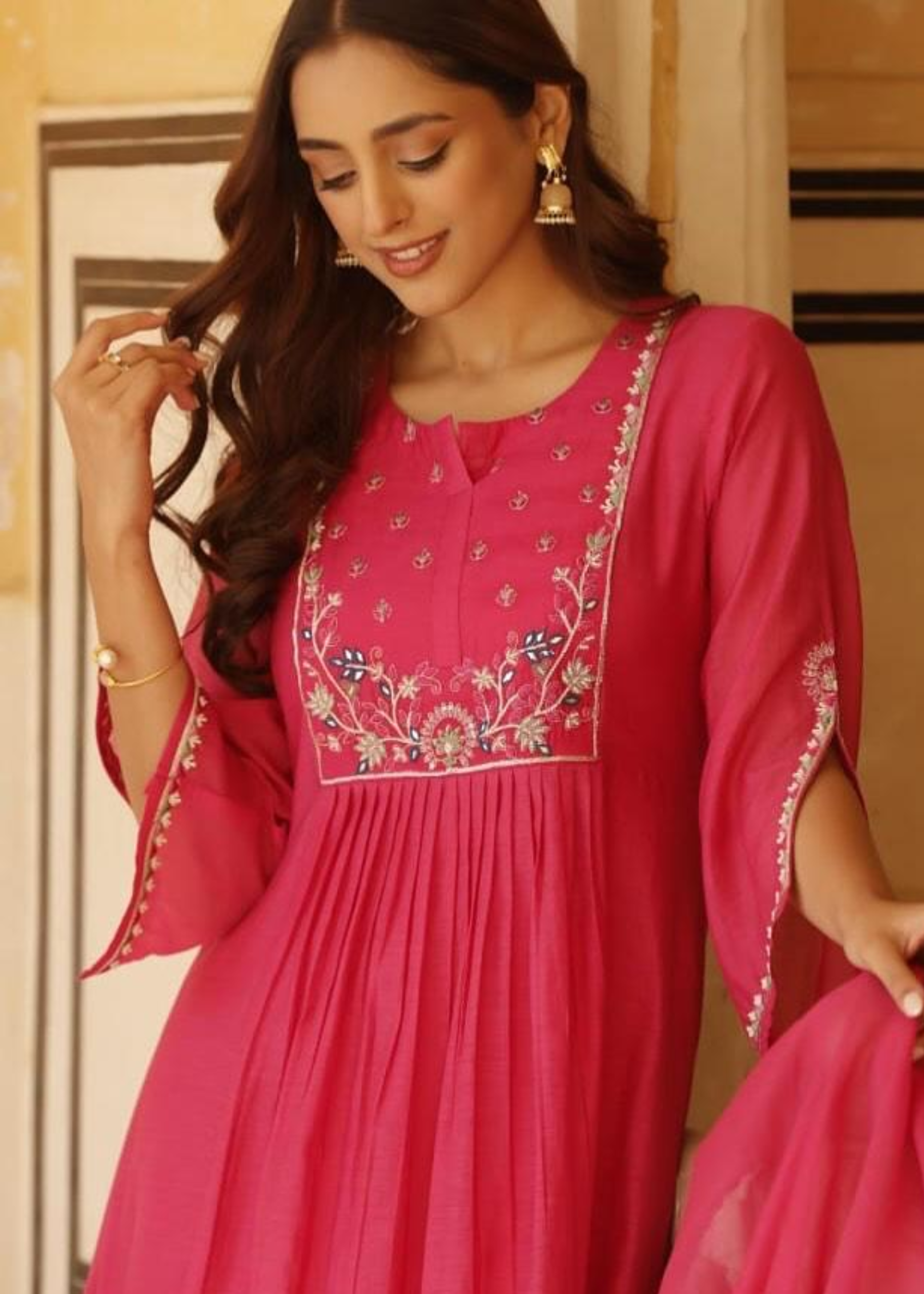 Chic and breathable vibrant pink flared kurta set made from soft pure mul cotton for all-day comfort.
