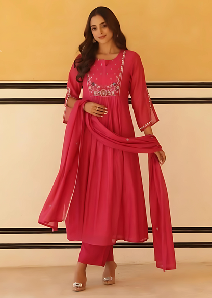 Graceful flared kurta set in pure mul cotton, featuring a rich vibrant pink hue for a timeless ethnic look.
