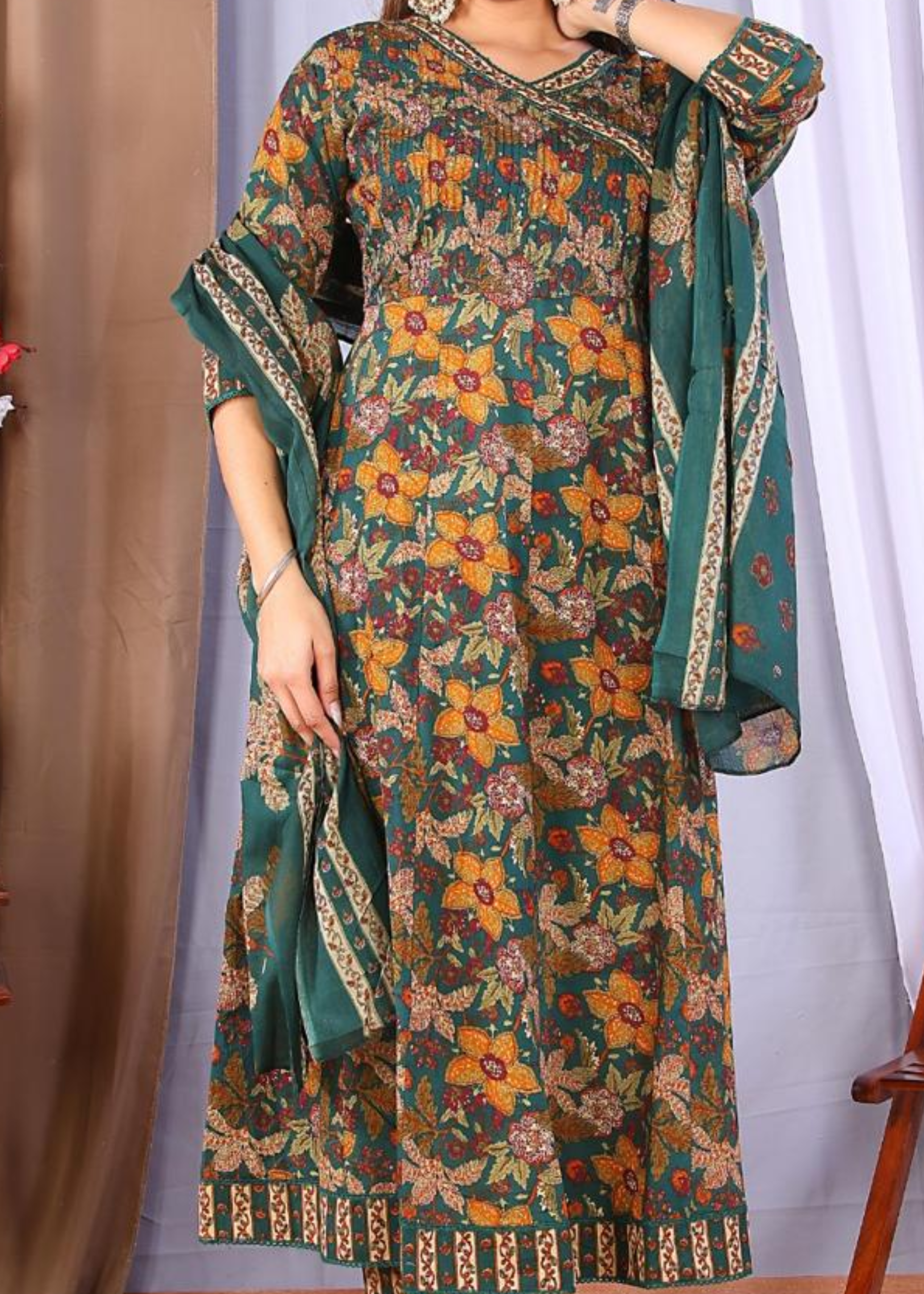 Elegant cotton frock suit set with floral prints, offering a perfect blend of comfort and style.
