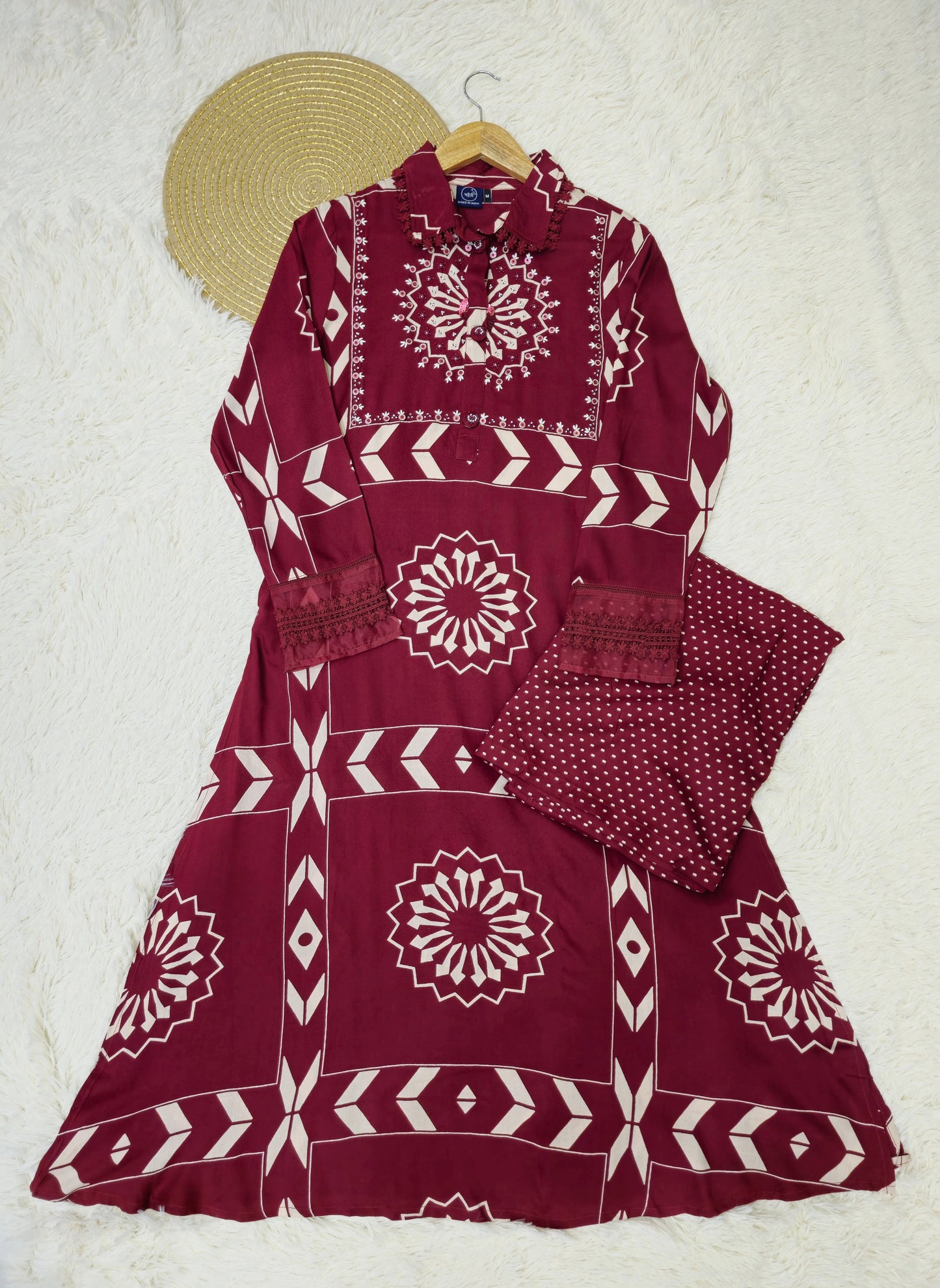 Stylish maroon A-line kurta set crafted for comfort and elegance, ideal for special occasions.
