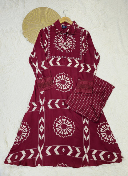 Stylish maroon A-line kurta set crafted for comfort and elegance, ideal for special occasions.
